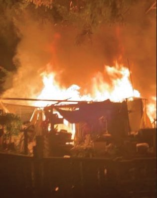 A workshop alongside a home and travel trailer caught fire on the night of Nov. 15.